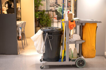 Cleaning tools cart and equipment parked walkway at the public a